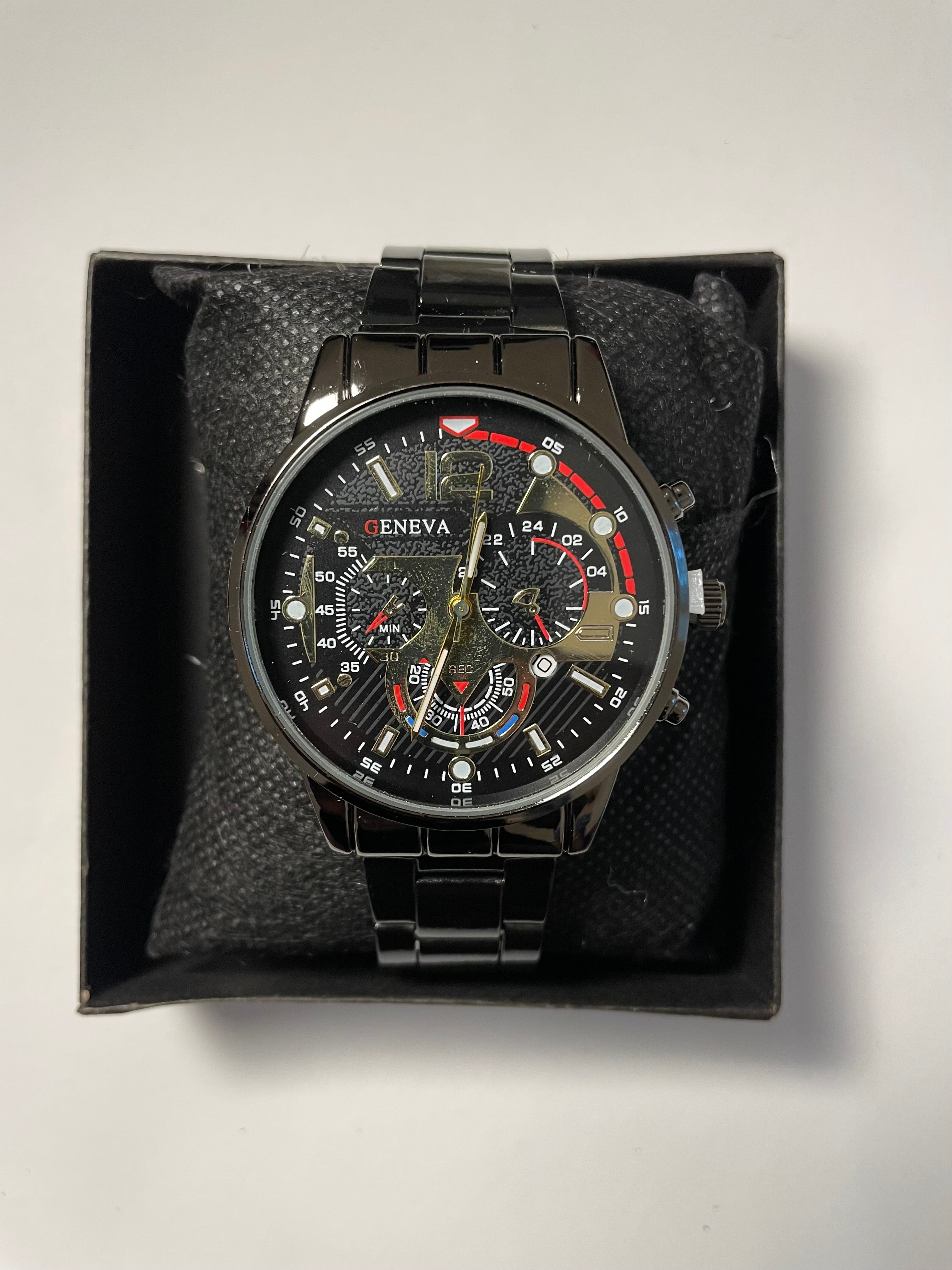 Black Geneva watch with red accents