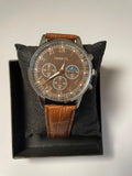 brown leather watch with moon phase