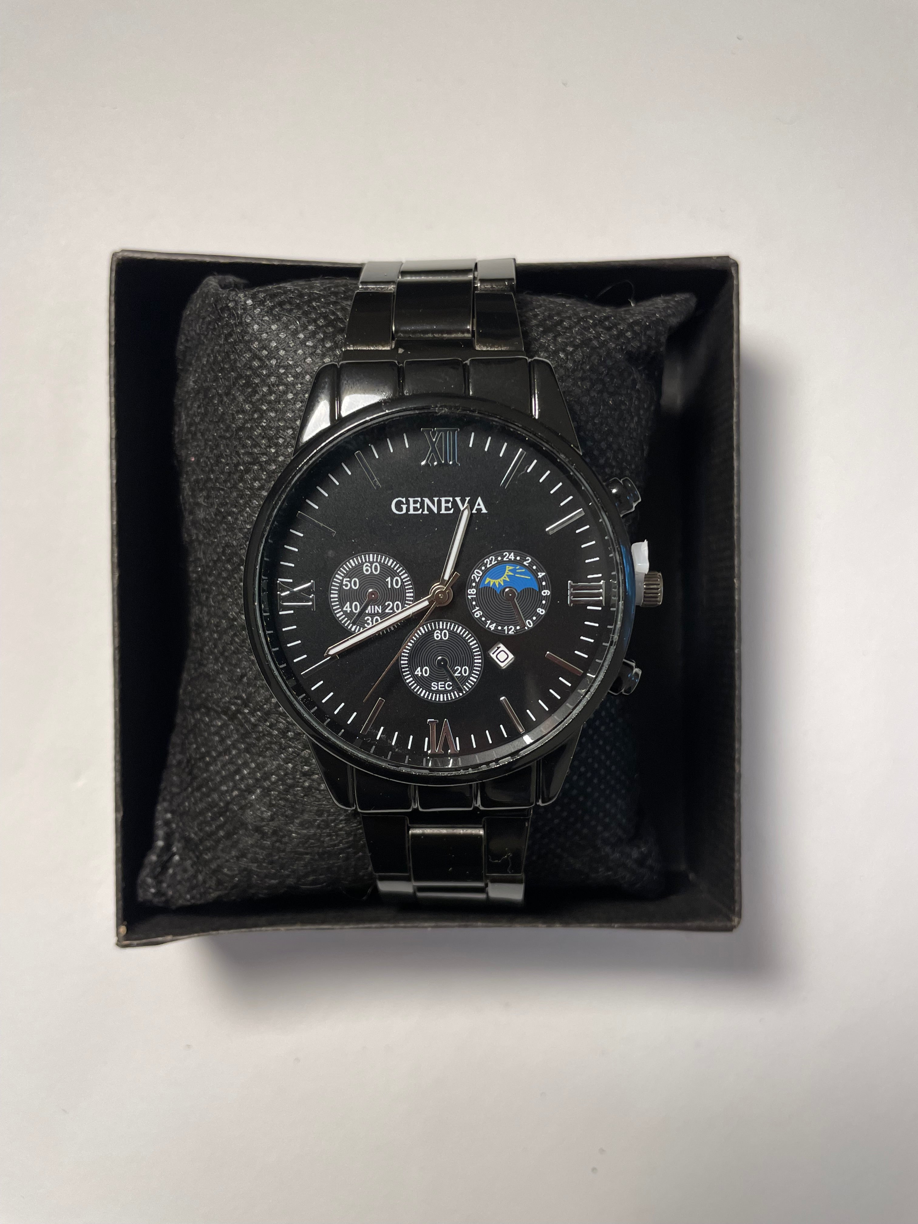 Black Geneva watch with moon phase