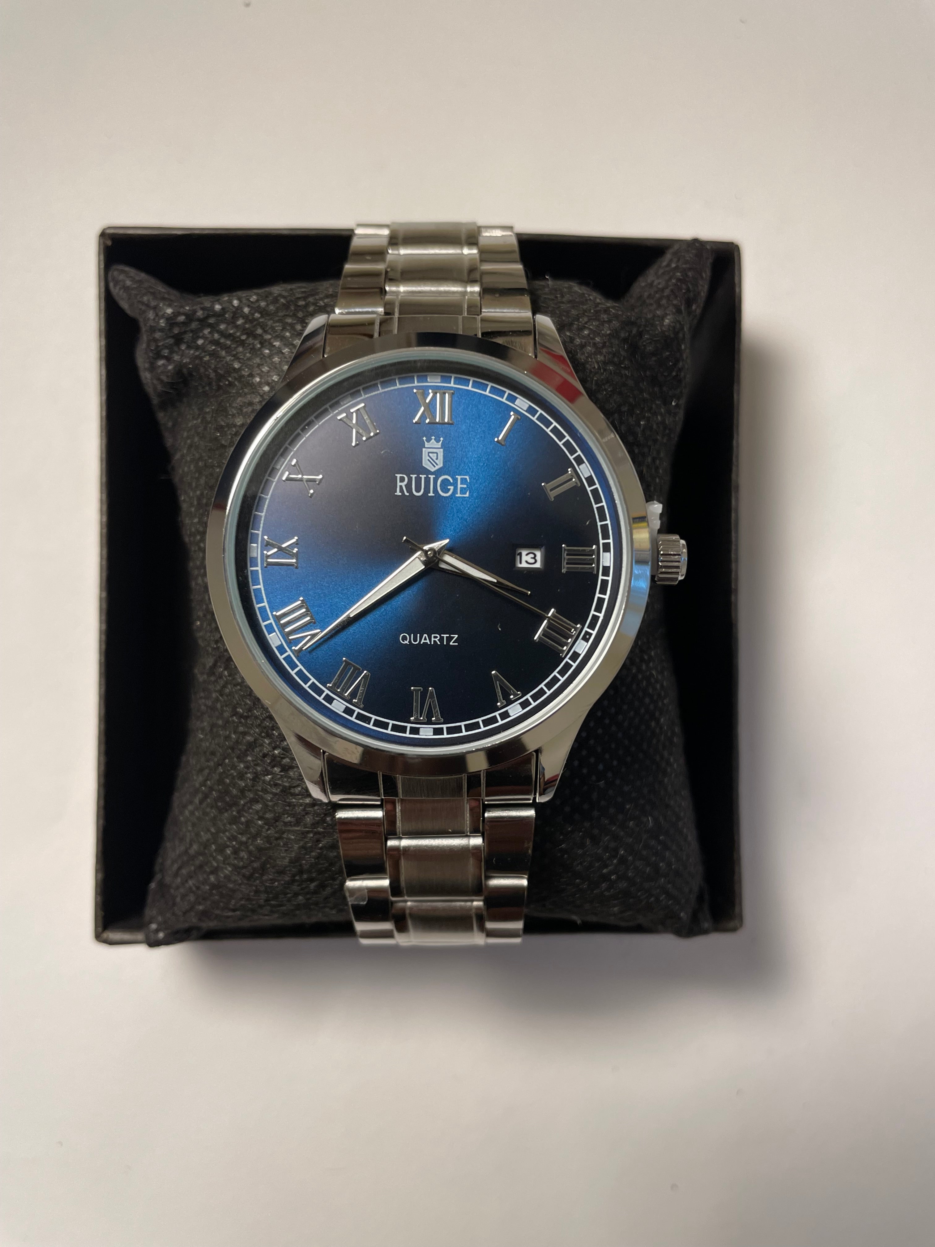 Royal blue and silver watch with Roman numerals #luxury #watches